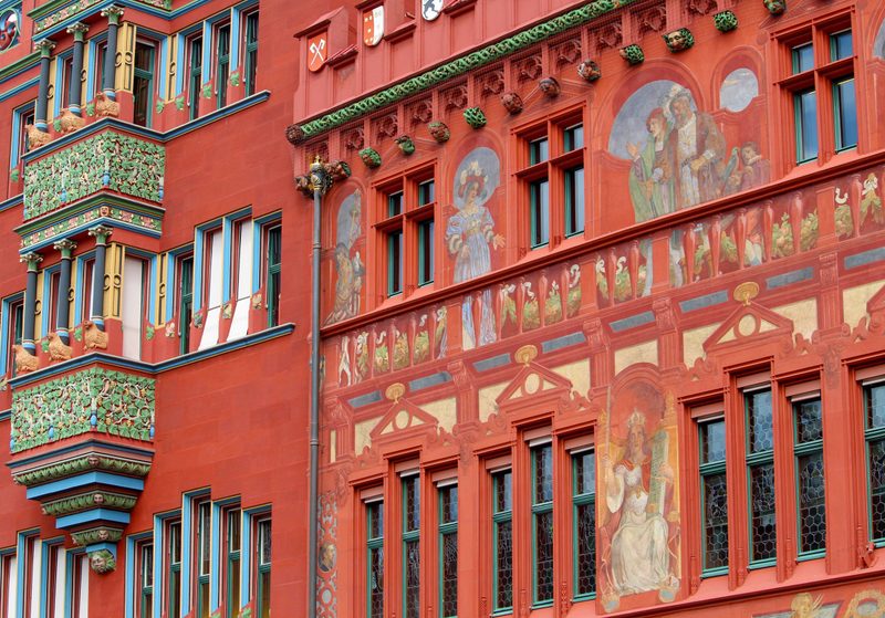 The painted red façade of Basel Rathaus on Marktplatz.